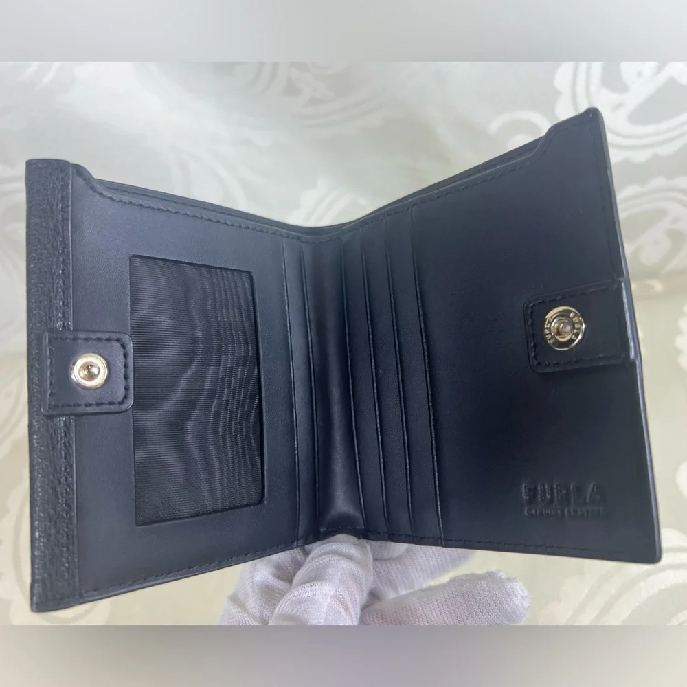 1017: Furla Black Pebbled Leather Compact Bifold Wallet